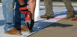 Step 2 - TPO is fastened to the deck at the seam.